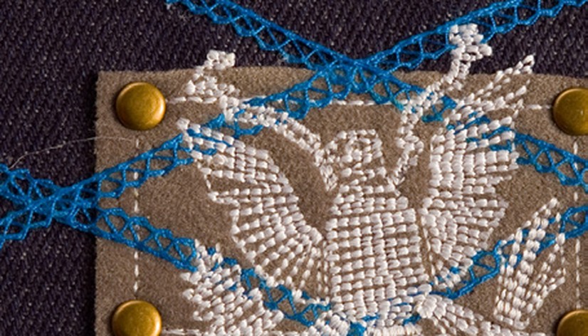 Flocking, grommets, serging and embroidery combined