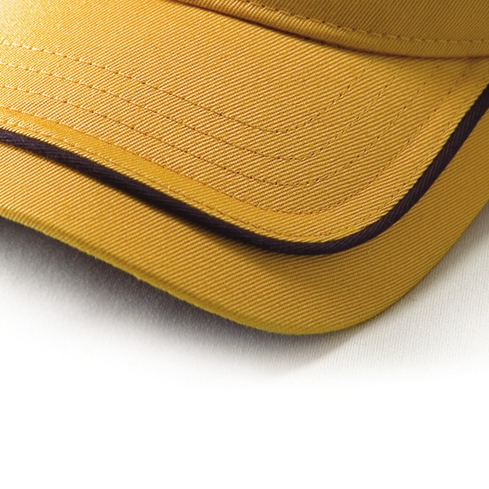 Close crop of parallel stitch rows across a cap visor